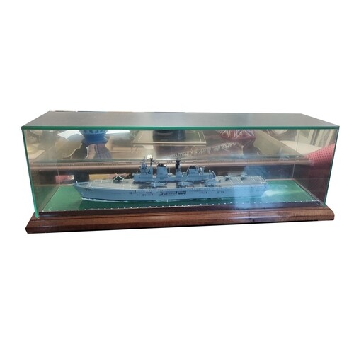 A SCALE PLASTIC MODEL OF AN AIRCRAFT CARRIER, in glass case....