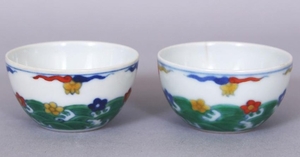 A SMALL PAIR OF CHINESE DOUCAI PORCELAIN WINE CUPS
