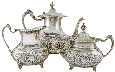 A Silver Rococo Style Three Piece Tea Set Comprising a tea pot, lidded sugar basin and a milk...