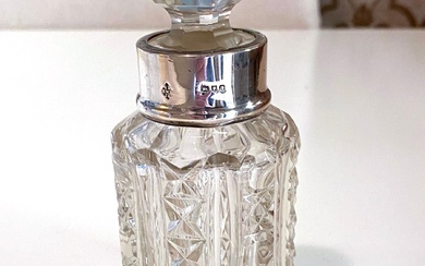 A Sterling Silver Topped Crystal Perfume Bottle, George Betjemann & Sons, London, 1896 & Two Napkins Rings, Sweden, c.1930