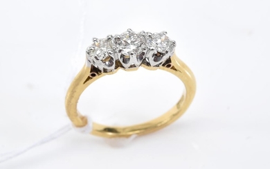 A THREE STONE DIAMOND RING IN 18CT GOLD