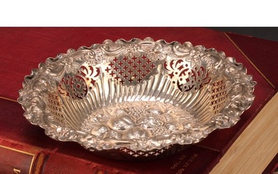 A Victorian silver shaped circular sweetmeat dish, the field...