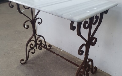 A WROUGHT IRON AND MARBLE TOP TABLE