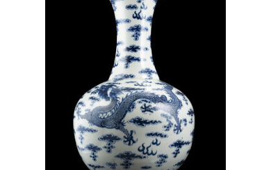 A blue and white porcelain bottle vase, decorated with dragons, on wood stand China, late Qing dynasty/Republic Period (1912-1949) (h....