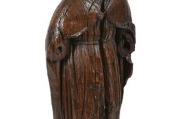A carved oak model of a standing Saint