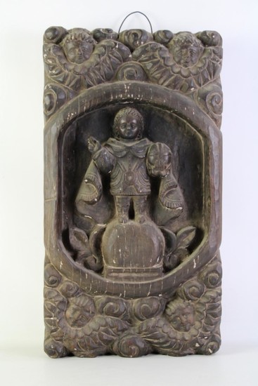 A carved wood wall relief of a Knight, 56 x 29cm