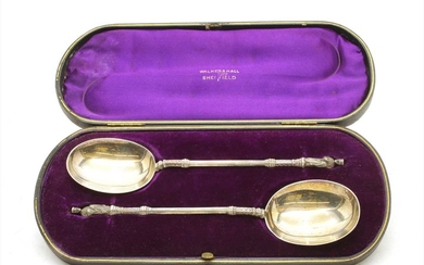A cased pair of Walker & Hall silver serving spoons