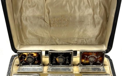 A cased set of six early 20th century silver and tortoiseshell menu holders