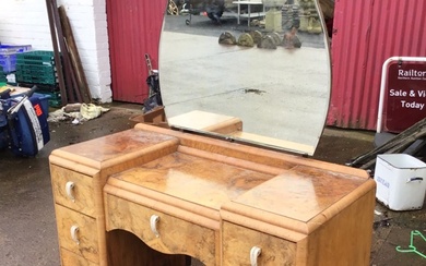 A deco walnut dressing table with cloud shaped mirror above...