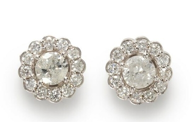 A diamond and eighteen karat white gold stud earrings