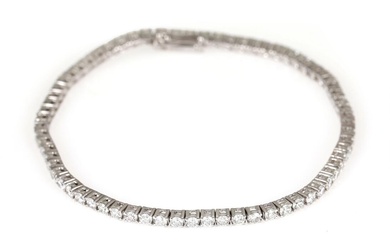 A diamond bracelet set with numerous brilliant-cut diamonds weighing a total of...
