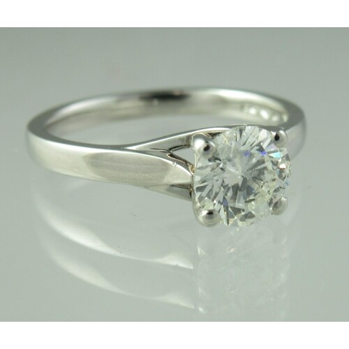 A diamond solitaire ring set in platinum. The brilliant cut...