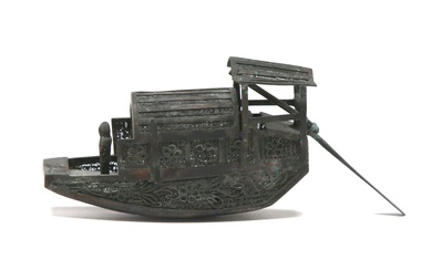 A fine miniature silver filigree in the form of boat
