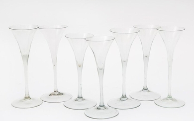 A group of seven slender trumpet bowl drinking glasses