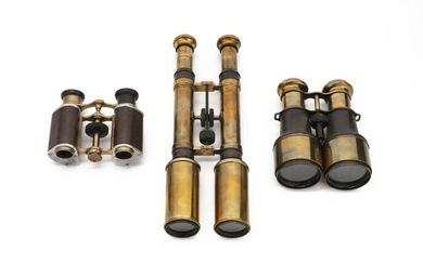 A group of three vintage binoculars