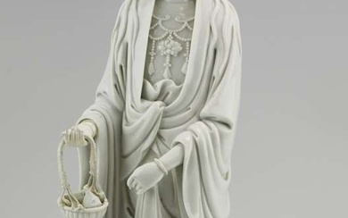 A large blanc-de-chine figure of a standing Guanyin