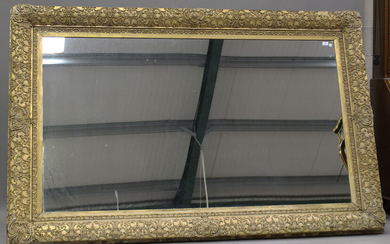 A large, late 19th century giltwood and gesso rectangular wall mirror with leaf scroll decoration, 1