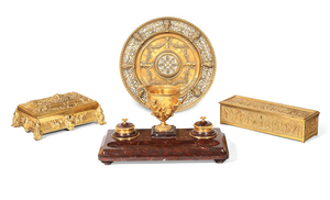 A late 19th / early 20th century French gilt bronze and rouge marble encrier, a similar period gilt bronze tazza and two similar gilt bronze table caskets
