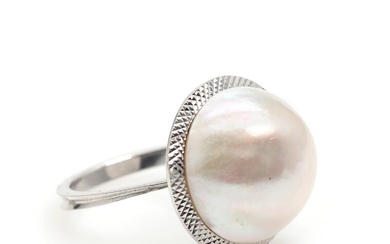 A mabé pearl ring set with a cultured mabé pearl, mounted in...