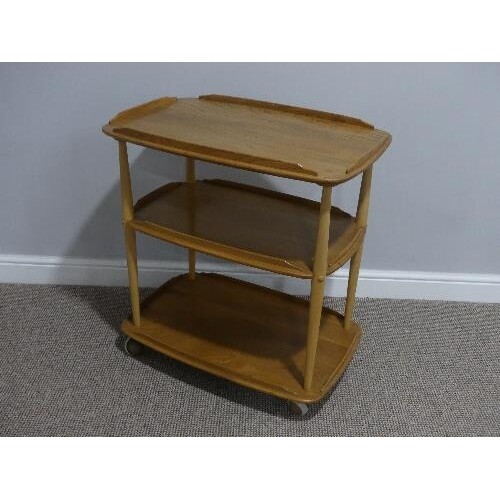 A mid 20thC Ercol three tier Trolley, Windsor 458, the round...