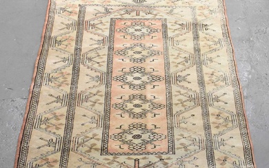 A modern cream and red ground rug with geometric design,...