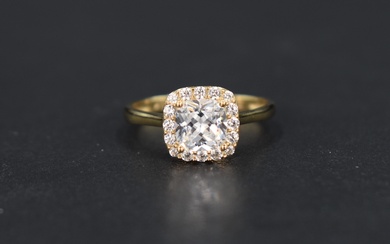 A modern cubic zirconia cluster ring, the central cushion cut cubic zirconia with a sixteen round