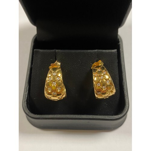 A pair of 18ct gold earrings, set with diamonds (one diamond...
