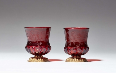 A pair of Bohemian ruby glass beakers