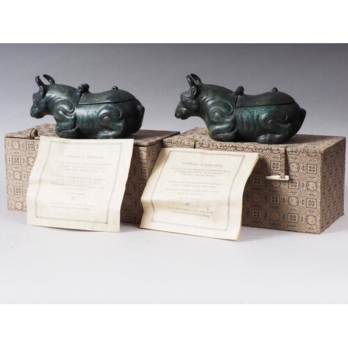 A pair of Chinese bronze limited edition lamps, formed as re...