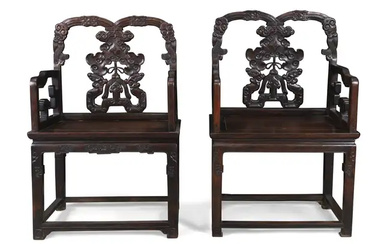 A pair of Chinese hongmu armchairs Qing dynasty, 19th century With carved...