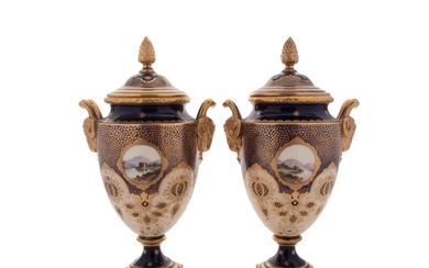 A pair of Coalport porcelain vases and covers with ram's-hea...