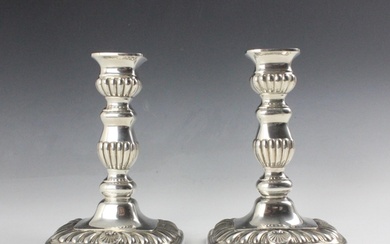 A pair of Edwardian silver candlesticks, Horace Woodward & C...
