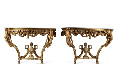 A pair of Louis XV style carved console tables