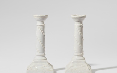 A pair of Neoclassical Proskau faience candlesticks