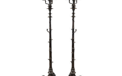 A pair of Renaissance style patinated bronze torcheres