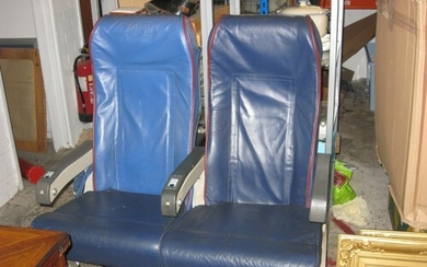 A pair of airline seats previously from a Transaero 737, wit...
