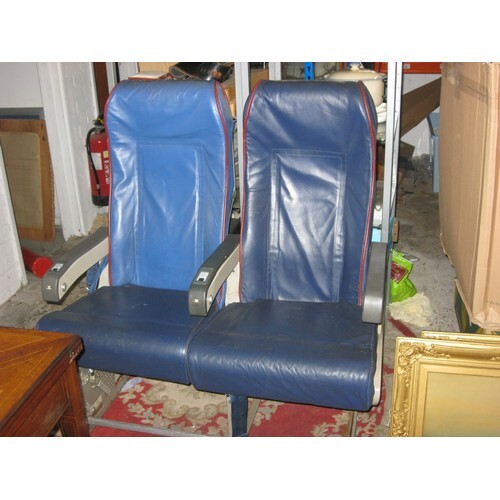 A pair of airline seats previously from a Transaero 737, wit...