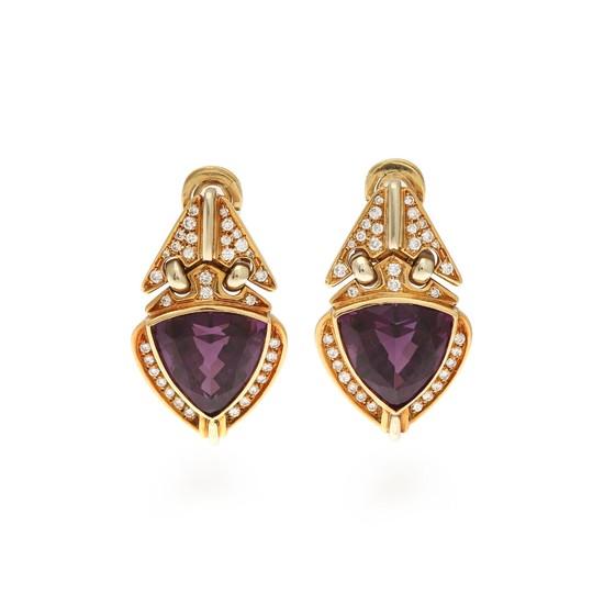 A pair of amethyst and diamond ear pendants each set with a fancy-cut amethyst and numerous brilliant-cut diamonds, mounted in 18k gold and white gold. (2)