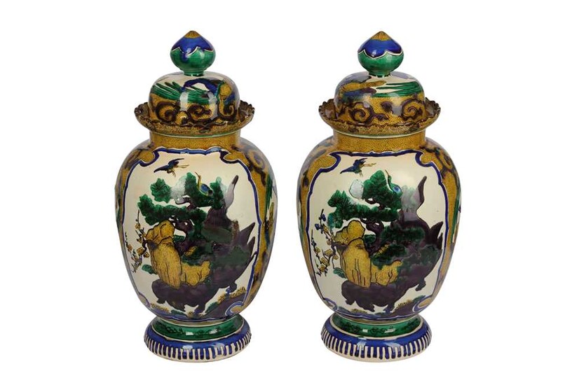 A pair of late 19th/early 20th century Sancai style pottery vases and covers