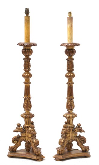 A pair of modern giltwood standard lamps in the form of candlesticks