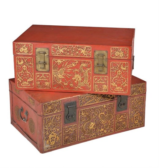 A pair of red lacquered and parcel gilt leather trunks