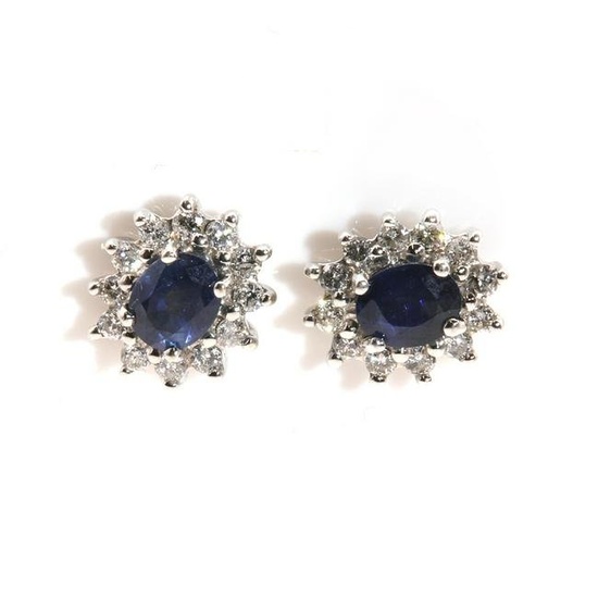 A pair of white gold sapphire and diamond oval cluster earrings