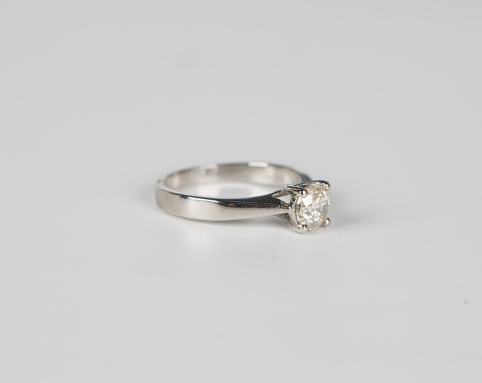 A platinum and diamond single stone ring, claw set with a circular cut diamond, weight 6.2g, ring si