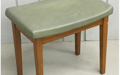 A retro stool, upholstered in green vinyl material. Dimensio...