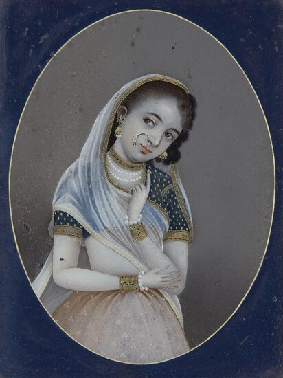 A reverse painting on glass of a young girl in Indian dress, India, early-mid 19th century, shown standing with one arm folded across her waist and the other raised to her face, her head tilted to one side, wearing a diaphanous scarf trimmed with...
