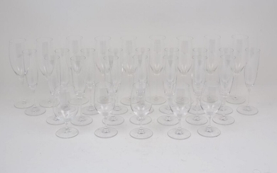 A set of nine Riedel wine glasses, of typical elongated...