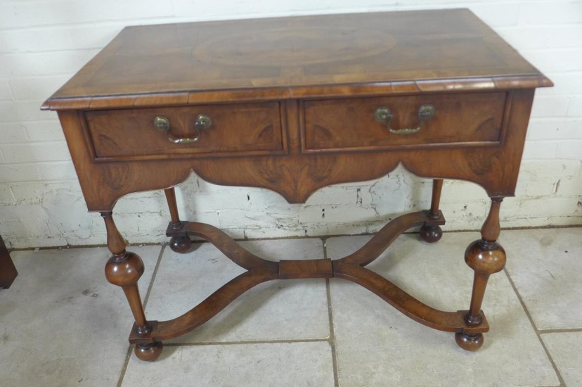 A walnut two drawer Queen Anne style side table, the top qua...