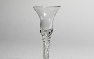 A wine glass c.1750-60, the bell-shaped bowl raised...