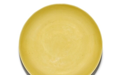 A yellow-glazed 'bajixiang' dish, Mark and period of Yongzheng | 清雍正 黃釉刻八吉祥紋盤 《大清雍正年製》款