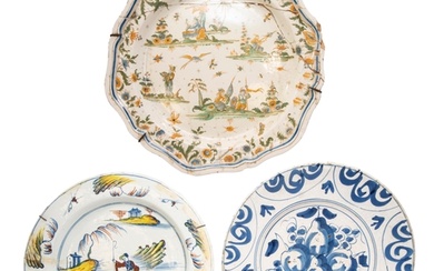 AN 18TH CENTURY DELFT DISH, the centre painted with fruits e...